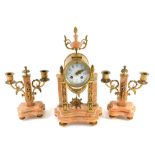 A French marble and gilt metal clock garniture, the 8cm diameter enamel Arabic dial surmounted by an