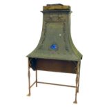 An Arts and Crafts brass fire canopy or chimney canopy, with Ruskin enamelled heart shape jewel, on