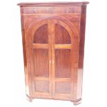 A 19thC flame mahogany free standing cupboard.