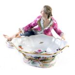 A late 19thC Meissen sweetmeat dish, with recumbent gentleman in flowing robes wearing pink jacket a