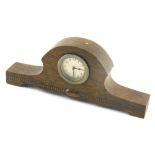A 1920/30s oak mantel timepiece, with silvered dial, 29cm wide.