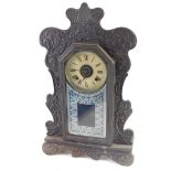 A late 19thC American oak Ansonia gingerbread mantel clock, with 13cm diameter Roman numeric dial, f
