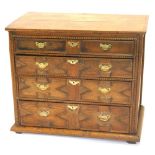 An early 18thC oak chest of four graduated drawers, with brass solid back plate handles, 84cm high,