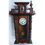 A late 19th/early 20thC Vienna walnut wall clock, the enamel dial, 81cm high. (AF)