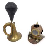 A 20thC brass car horn, with rubber end and a miniature copper and brass diver's helmet, 20cm high.
