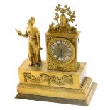 A French gilt metal and figural mantel timepiece, composed of a lady with a book beside clock with s