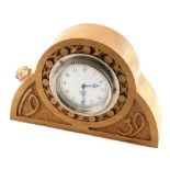 Withdrawn from this sale. A reproduction oak mantel clock, bearing carved mouse