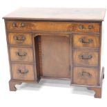 A high quality reproduction flame mahogany kneehole desk, in George III style, 92cm wide.