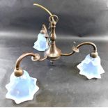 An Art Nouveau three branch chandelier, with vaseline glass shades, 31cm high.