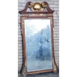 A 19thC parcel gilt walnut pier glass or wall mirror, with broken arch pediment, with shell and scro