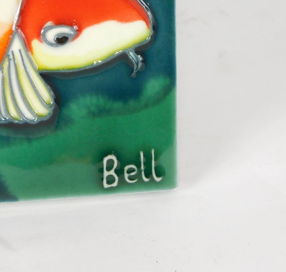 A pottery wall plaque singed Bell, Moorcroft style, tube line decorated with fish in colours, 31cm x - Image 2 of 2