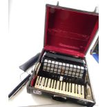 A mid 20thC Parrot 120 base piano accordion, in black trim with seven buttons, 44cm wide, in outer c