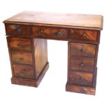 A Victorian mahogany pedestal desk, having an arrangement of drawers with turned handles, 113cm wide