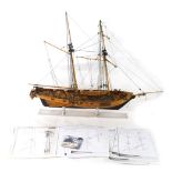 A scale model of a ship, with realistic rigging and deck, on stand, with kit making instructions, 77