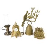 Various brassware, a French bell with hanging bracket, 27cm high, oil lamp, miniature clock, desk ti