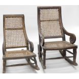 A pair of child's rocking chairs, with cane seats.