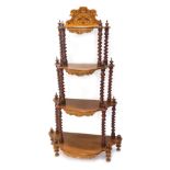 A 20thC graduated four tier whatnot, with barley twist supports, on bun feet, with a stencilled top,