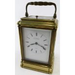A 20thC brass repeating carriage clock, the 6cm wide back plate stencilled with a Roman numeric dial