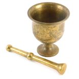 A turned brass pestle and mortar, possibly 19thC, the mortar 11cm high.