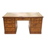 A Victorian pitch pine kneehole desk by A Blain and Son, Liverpool, carved to simulate bamboo, the r