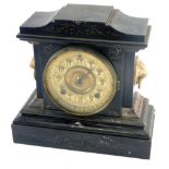 A late 19thC Ansonia mantel clock, in ebonised cast iron base decorated to simulate slate or marble,