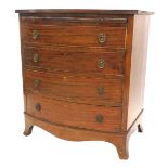 An early 19thC mahogany bow front bachelor's chest, with reeded top, brushing slide, and four gradua