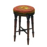 A Regency mahogany stool, with Berlin wool work top, and turned legs, 50cm high, 30cm oval.
