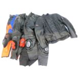 A quantity of motorcycle clothing, red and blue leather jacket, black riding jacket, etc. (1 box)