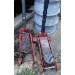 Two heavy duty red 5 ton car jacks.