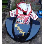 Three go kart hoods, comprising a black kart, a Cat Racing Raider Kart, and a DDJ motor bike cover.