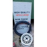 A Motor Service advertising sign, tube tyre and a Ford alloy. (3)