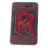 A Rolls Royce car badge.