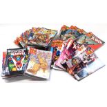 A group of modern Marvel comics, to include Ultimate Spiderman, X-Men Essentials, Avengers and other