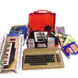 A Commodore 64, joysticks, user manuals, etc. (1 crate)