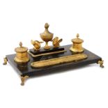 A 19thC French Empire bronze and ormolu double encrier, the two ink receivers with hinged lids and a
