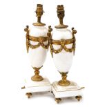 A pair of Continental white marble and gilt metal urn shaped table lamps, each on a square base, 41c