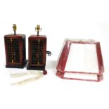 A pair of Chinese simulated red lacquer abacus square section table lamps, the bases measuring 32cm