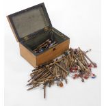 A Victorian mahogany and marquetry inlaid box, the hinged lid enclosing a quantity of lace bobbins w