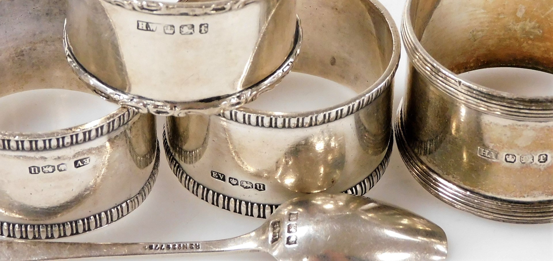 A group of small silver, comprising four napkin rings of differing designs and dates, together with - Image 2 of 2