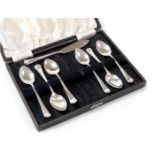 A set of six George VI silver coffee spoons, each with a shaped and engraved handle, Birmingham 1944