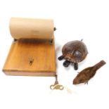 A small tinplate windup clockwork pecking bird, with key, together with a clockwork counter top tort