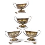 A set of four Victorian silver two handled open salts, with part fluted decoration on pedestal bases