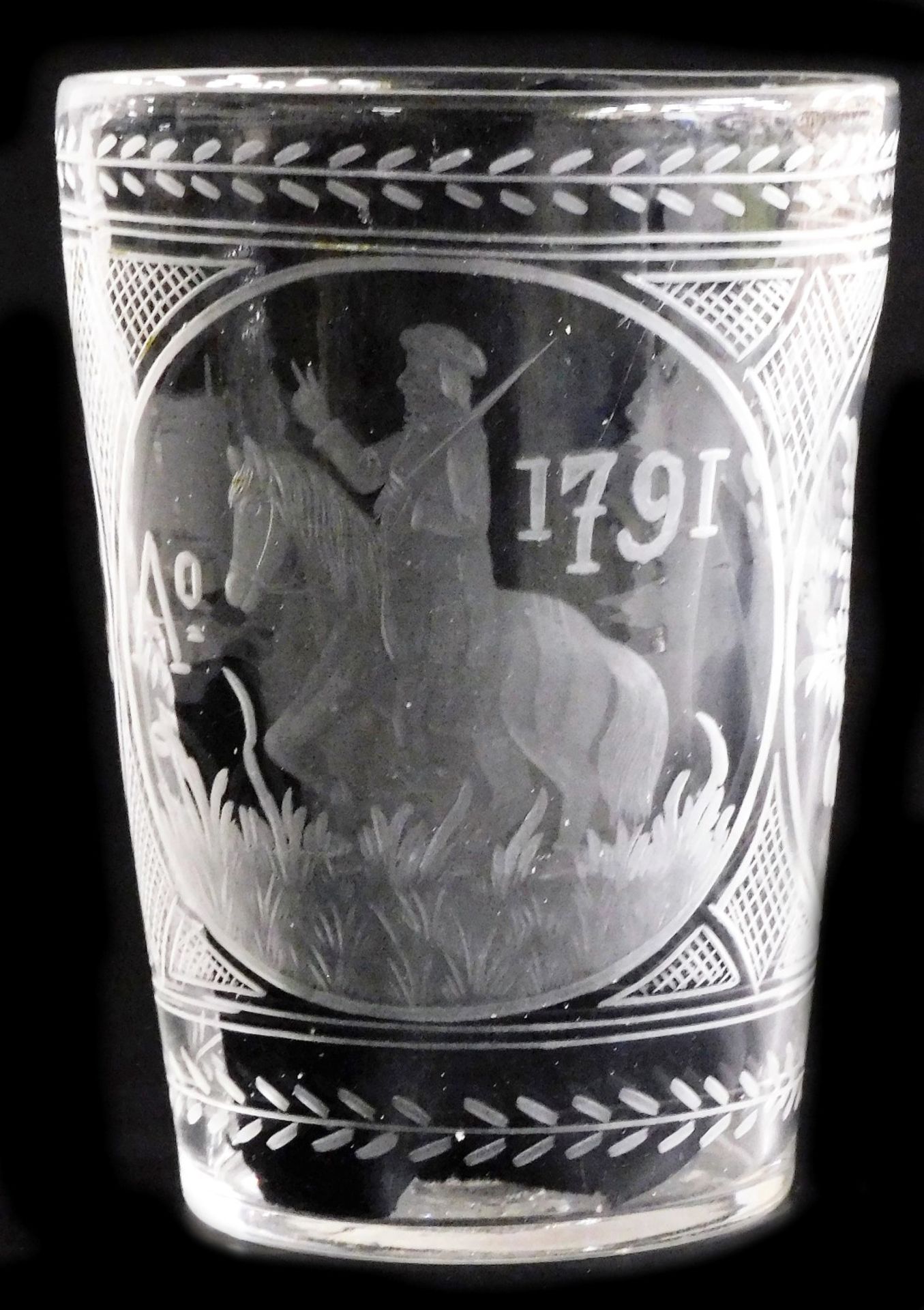 A late 18thC glass vase, the central roundel engraved with a figure on a horse, and AD1791, flanked