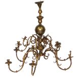 A brass effect Dutch style twelve branch chandelier, with turned centre support, scrolling arms, 116