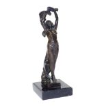 After Leon Noel Delagrane (French 1872-1910). A bronze figure of a standing dancer, semi clad, raise