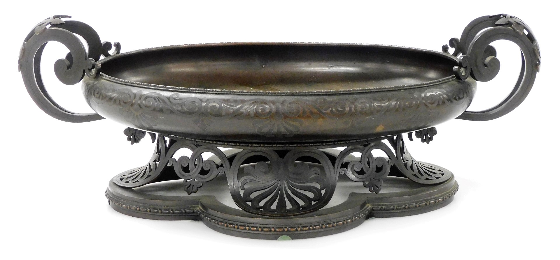 An early 20thC French bronze oval jardiniere table centre, with scrolling handles and engraved with