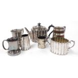 An Elkington & Co silver plated three piece tea service, comprising teapot, milk jug and two handled