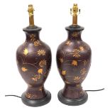 A pair of Chinese brown glazed table lamps, of baluster form, gilt decorated with flowers, 58cm high