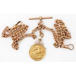 An Edward VII gold sovereign 1904, in a pendant mount, on a 9ct gold curb link Albert chain, with T