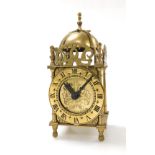 A Smiths Clocks and Watches electric driven brass lantern clock, of conventional form, 18cm high.